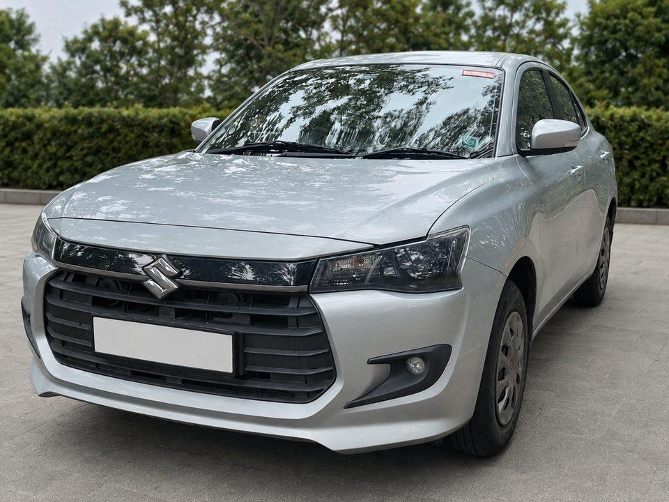 Maruti Suzuki Dzire — Silver self-drive car in Bengaluru